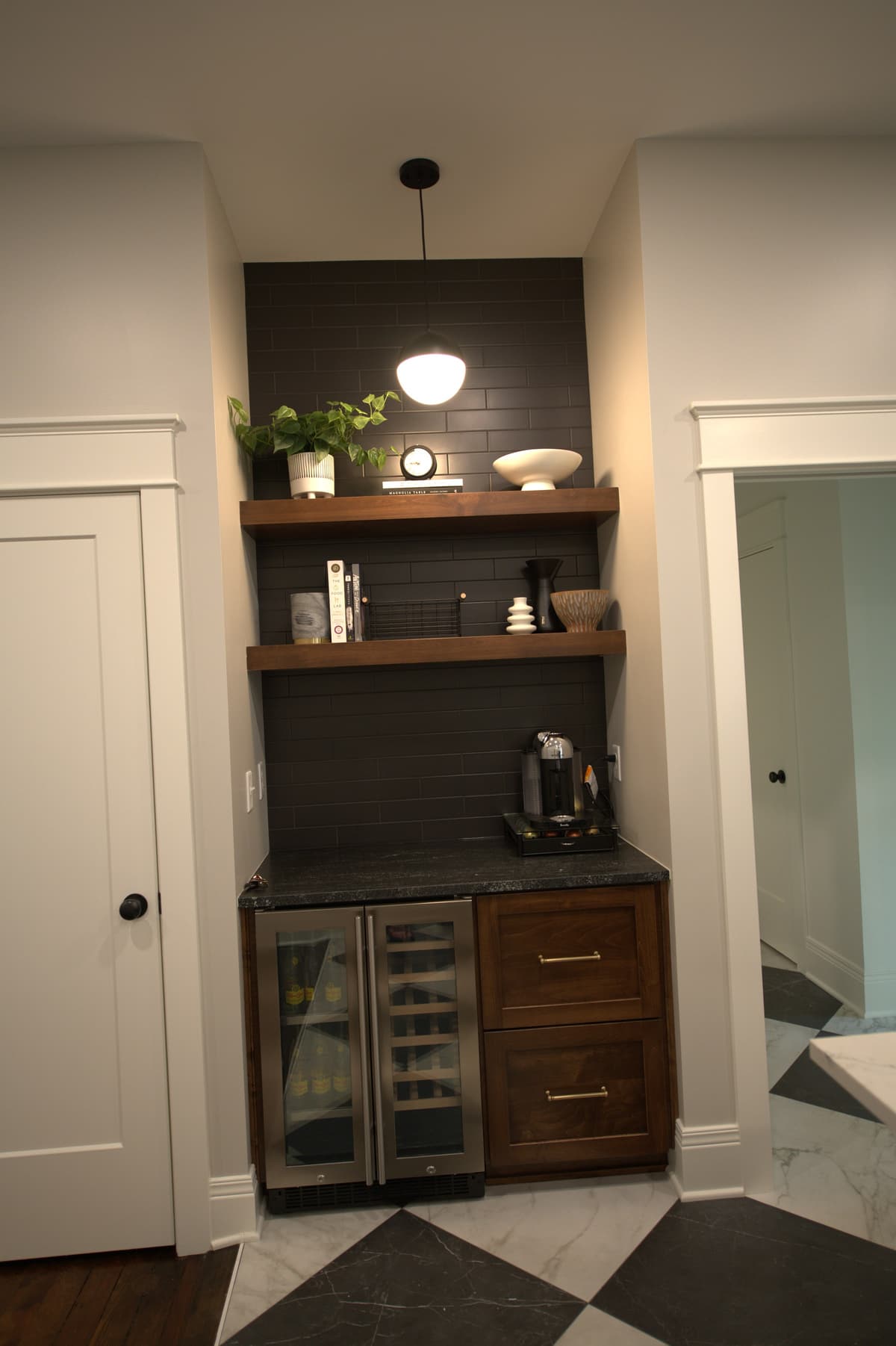 Built-in shelving nook with brass sconce