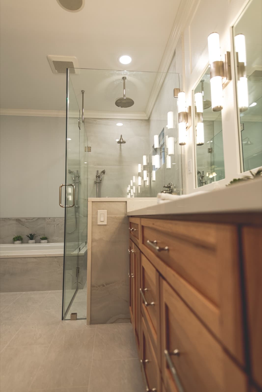 Freestanding tub with floor-mounted filler and tile surround